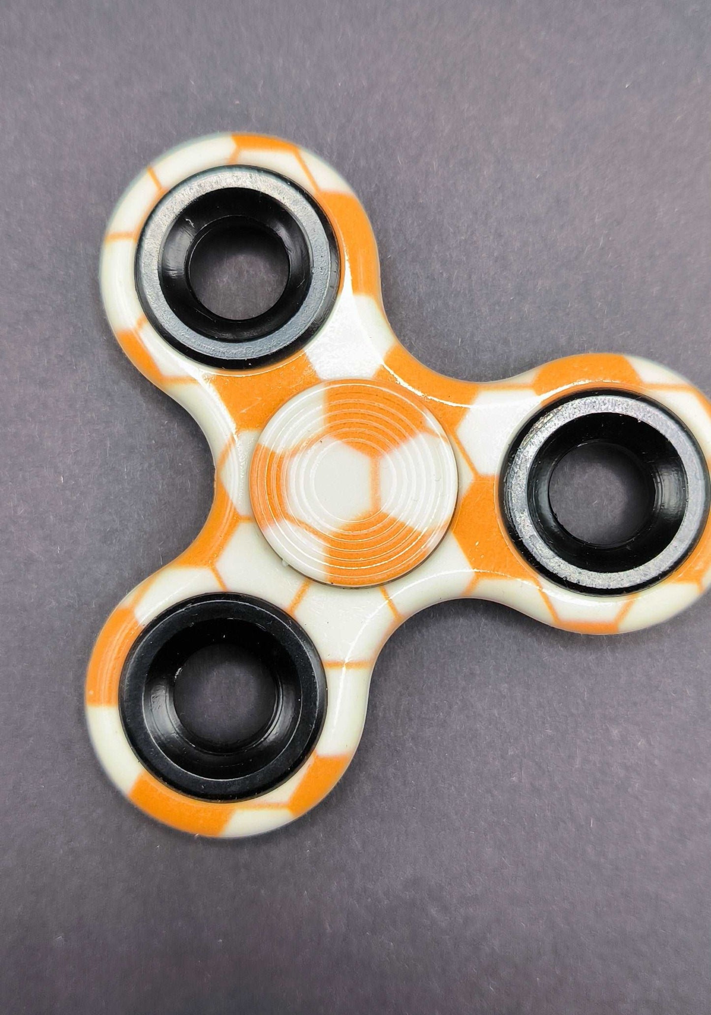 Fidget Sinner mit Kugellager  Muster Fußball Orange