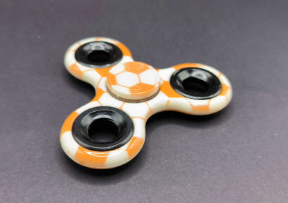 Fidget Spinner Muster Fußball Orange mit Kugellager Ringe Schwarz