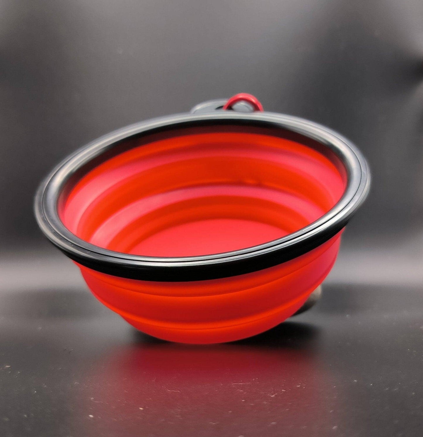 a red bowl sitting on top of a table 